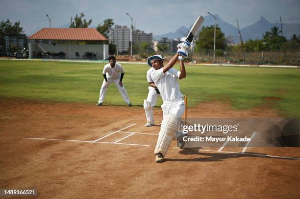 batsman playing a big shot during a cricket match - cricket bildbanksfoton och bilder