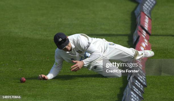Durham captain Scott Borthwick dives to stop a boundary during day one of the LV= Insurance County Championship Division 2 match between Durham and...