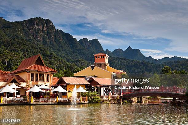 oriental village shopping centre and gunung machinchang, pantai kok. - pantai kok stock pictures, royalty-free photos & images