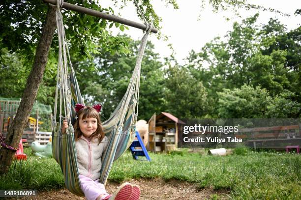 cute smiling girl playing in a back yard. - cat costume stock pictures, royalty-free photos & images