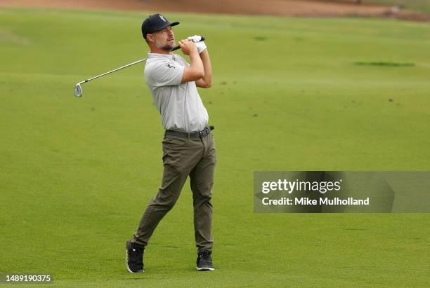 Ryan Moore of the United States plays an approach shot on the third hole during the first round of the AT&T Byron Nelson at TPC Craig Ranch on May...