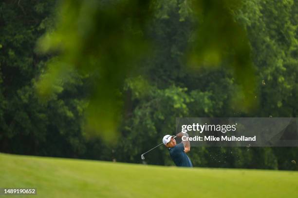 Pan of Taiwan plays an approach shot on the third hole during the first round of the AT&T Byron Nelson at TPC Craig Ranch on May 11, 2023 in...