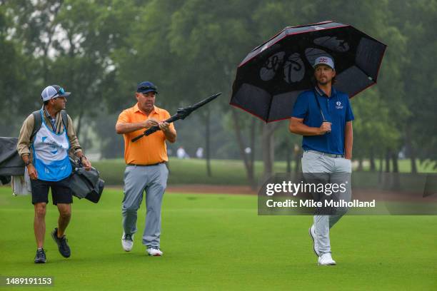 Kevin Stadler of the United States and Roger Sloan of Canada walk the third hole during the first round of the AT&T Byron Nelson at TPC Craig Ranch...