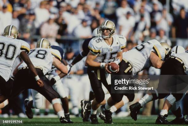 Drew Brees, Quarterback for the Purdue University Boilermakers prepares to throw a pass downfield from the pocket during the NCAA Big Ten Conference...