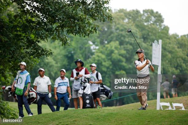 Bernhard Langer of Germany watches his tee shot on the third hole during the first round of the Regions Tradition at Greystone Golf and Country Club...
