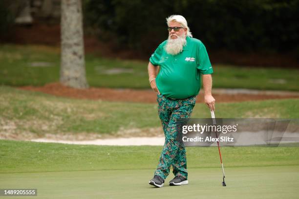 John Daly of the United States waits to putt on the third green during the first round of the Regions Tradition at Greystone Golf and Country Club on...