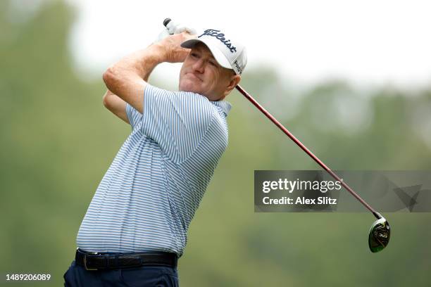 Steve Flesch of the United States watches his tee shot on the second hole during the first round of the Regions Tradition at Greystone Golf and...