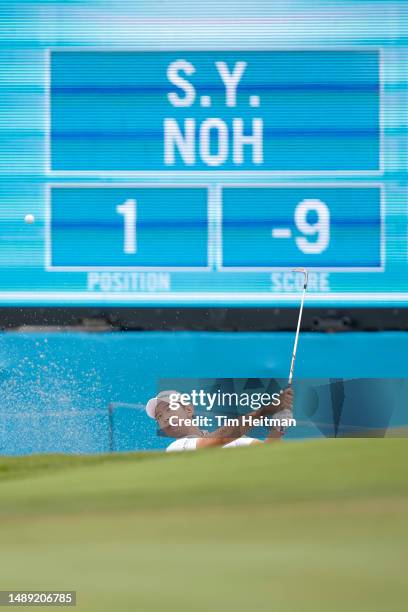 Seung-yul Noh of South Korea chips from a greenside bunker on the 16th hole during the first round of the AT&T Byron Nelson at TPC Craig Ranch on May...