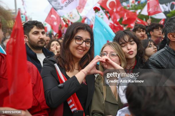 Supporters makes a heart symbol as he takes part during rally while campaigning for the presidential election in Sancaktepe district on May 11, 2023...