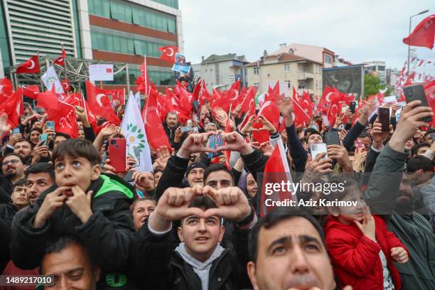 Supporters makes a heart symbol as he takes part during rally while campaigning for the presidential election in Sancaktepe district on May 11, 2023...