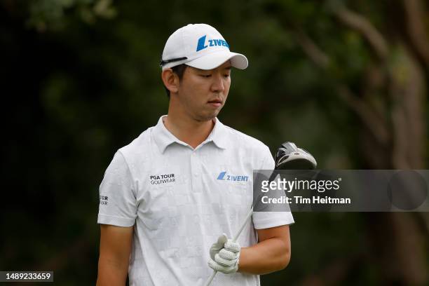 Seung-yul Noh of South Korea looks at his club on the 14th tee during the first round of the AT&T Byron Nelson at TPC Craig Ranch on May 11, 2023 in...