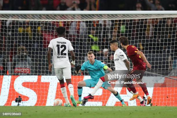 Edoardo Bove of AS Roma scores the team's first goal as Lukas Hradecky of Bayer 04 Leverkusen attempts to make a save during the UEFA Europa League...
