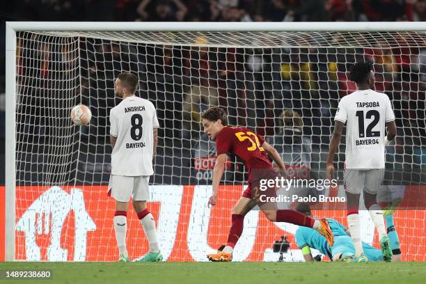 Edoardo Bove of AS Roma celebrates after scoring the team's first goal as Lukas Hradecky of Bayer 04 Leverkusen reacts after failing to make a save...