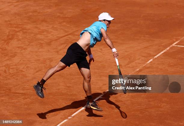 Mackenzie McDonald of the United States serves against against Marco Cecchinato of Italy during the Men's Singles First Round match on Day Four at...