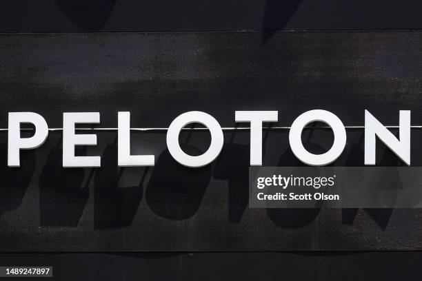 Sign hangs above a Peloton store in a shopping mall on May 11, 2023 in Oak Park, Illinois. The exercise equipment maker said it is recalling more...