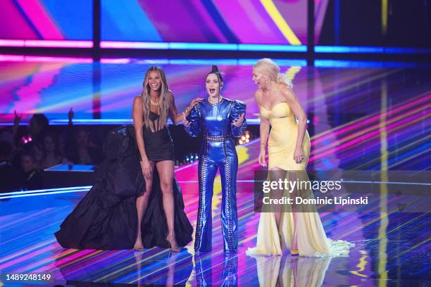 Hosts Alesha Dixon, Julia Sanina and Hannah Waddingham on stage during the Eurovision Song Contest Semi Final 2 on May 11, 2023 in Liverpool, England.