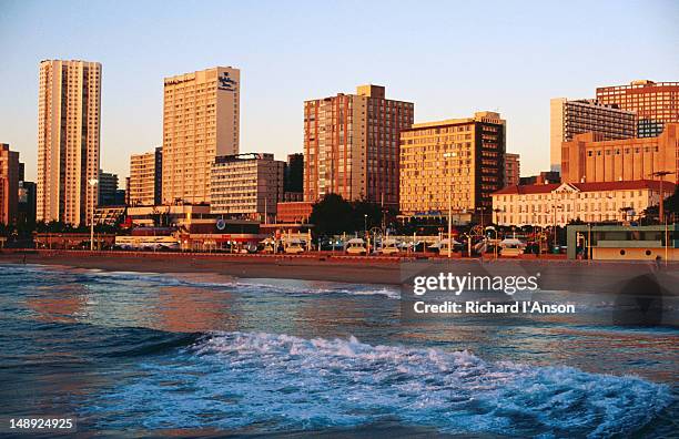 beachfront at sunrise. - durban sky stock pictures, royalty-free photos & images