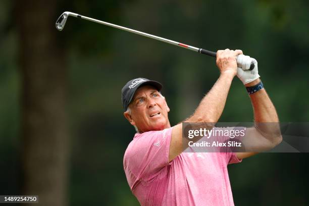 Tom Lehman of the United states watches his tee shot on the fourth hole during the first round of the Regions Tradition at Greystone Golf and Country...
