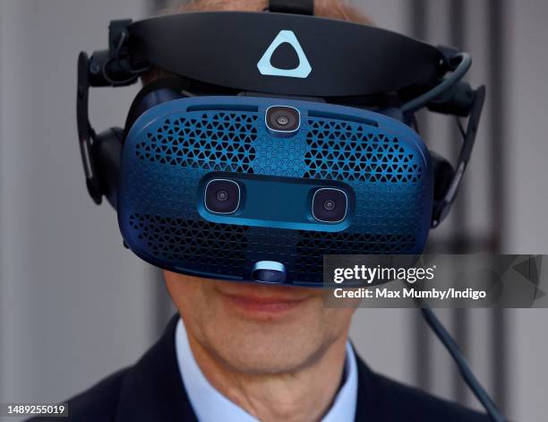 Prince Edward, Duke of Edinburgh tries a virtual reality horse racing simulator as he attends day 1 of the 2023 Royal Windsor Horse Show in Home...