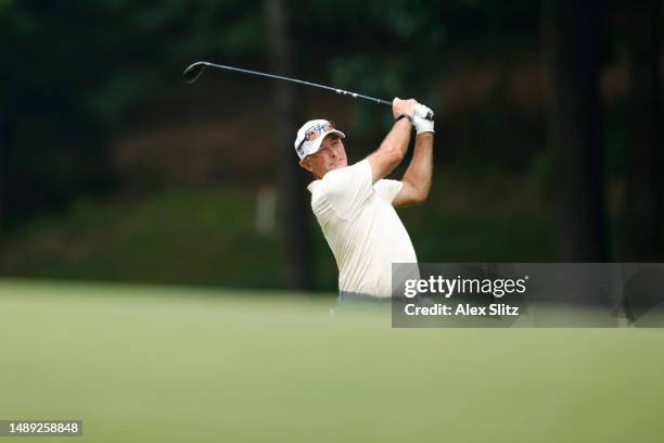 David McKenzie of Australia watches his shot on the 18th hole during the first round of the Regions Tradition at Greystone Golf and Country Club on...