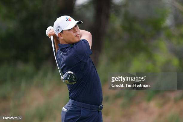 Si Woo Kim of South Korea plays his shot from the 14th tee during the first round of the AT&T Byron Nelson at TPC Craig Ranch on May 11, 2023 in...