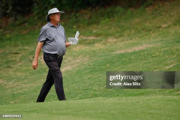 Kirk Triplett of the United States waits to play a shot on the 18th hole during the first round of the Regions Tradition at Greystone Golf and...