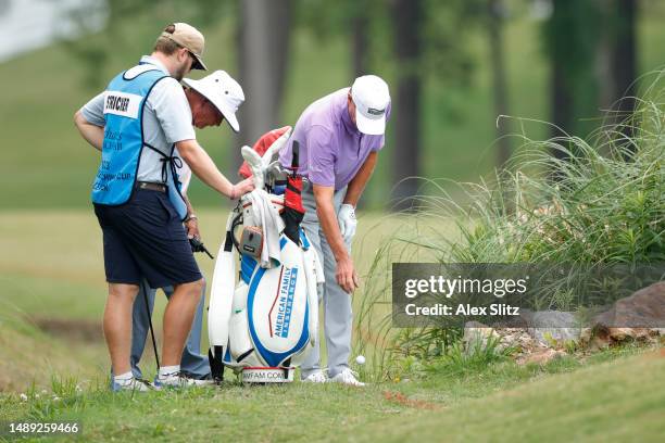 Steve Stricker of the United States drops his ball after a ruling on the 18th hole during the first round of the Regions Tradition at Greystone Golf...