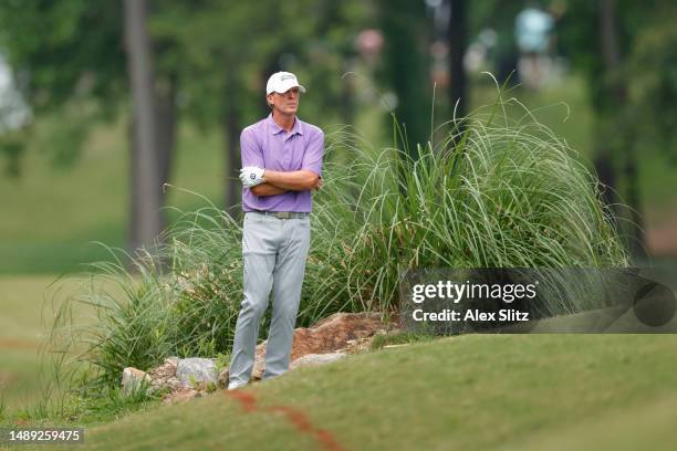 Steve Stricker of the United States waits for a ruling official on the 18th hole during the first round of the Regions Tradition at Greystone Golf...