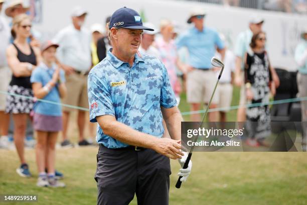 Ernie Els of South Africa watches his chip shot onto the 18th hole during the first round of the Regions Tradition at Greystone Golf and Country Club...