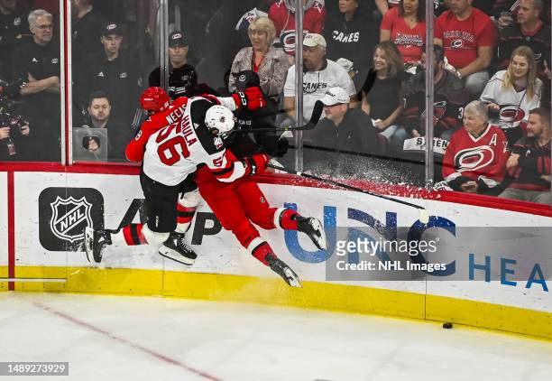 Erik Haula of the New Jersey Devils hits Martin Necas of the Carolina Hurricanes during the first period in Game Five of the Second Round of the 2023...