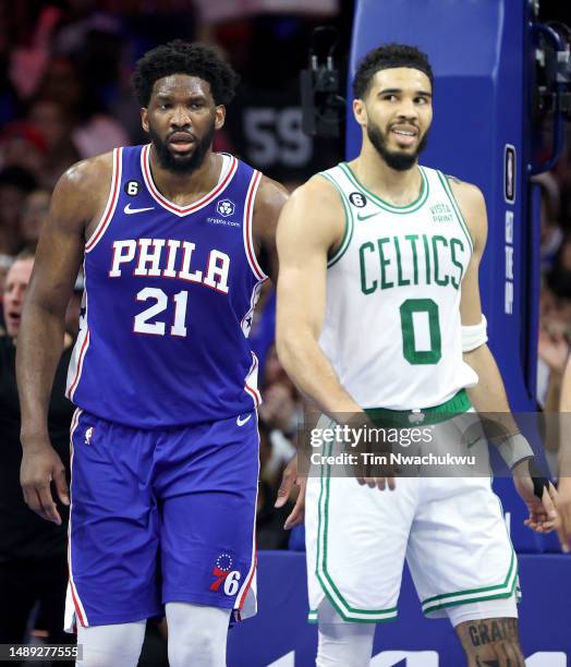 Joel Embiid of the Philadelphia 76ers reacts against Jayson Tatum of the Boston Celtics during the first quarter in game six of the Eastern...