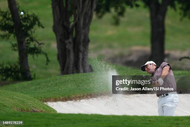 Scottie Scheffler of the United States hits one from a fairway bunker on hole during the first round of the AT&T Byron Nelson at TPC Craig Ranch on...