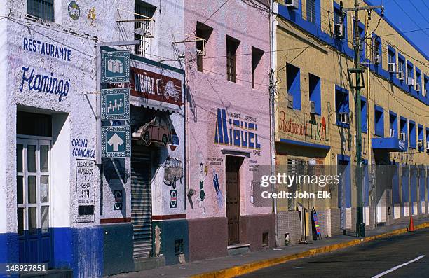 colourful building facades line the streets of merida. - mérida mexiko bildbanksfoton och bilder