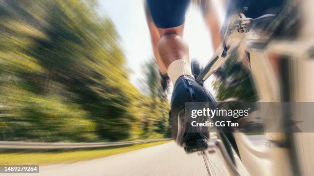 point of view male chinese cyclist cycling alone at rural scene - road cycling stock pictures, royalty-free photos & images