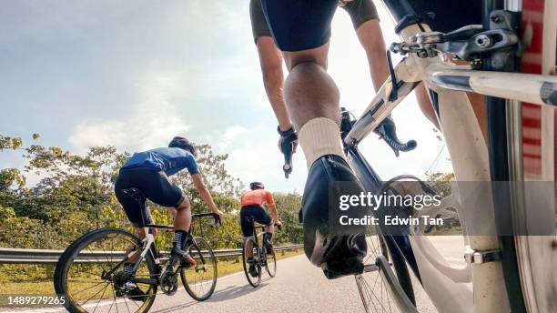 point of view male chinese cyclist competing in sports race cycling event at rural scene - wielrennen stockfoto's en -beelden