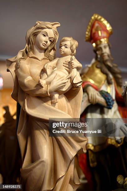 wooden carved religious figures in workshop. - oberammergau stock pictures, royalty-free photos & images