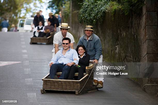 people in basket sled on monte toboggan run. - montre stock pictures, royalty-free photos & images