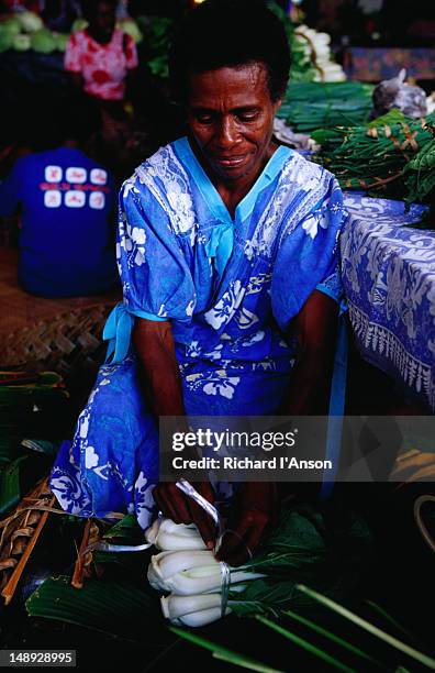 woman preparing vegetables for sale at city market stall. - shefa stock pictures, royalty-free photos & images