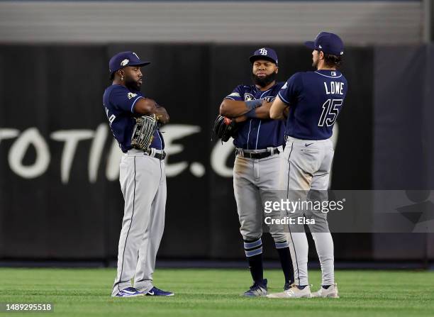 Randy Arozarena,Manuel Margot and Josh Lowe of the Tampa Bay Rays celebrate the win over the New York Yankees at Yankee Stadium on May 11, 2023 in...