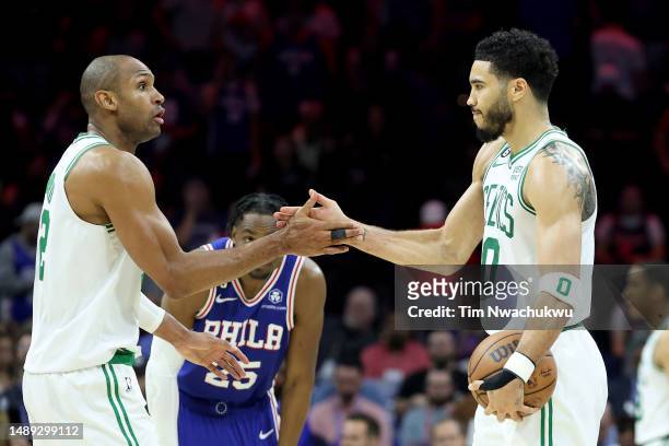 Al Horford and Jayson Tatum of the Boston Celtics celebrate after defeating the Philadelphia 76ers in game six to tie at 3-3 the Eastern Conference...