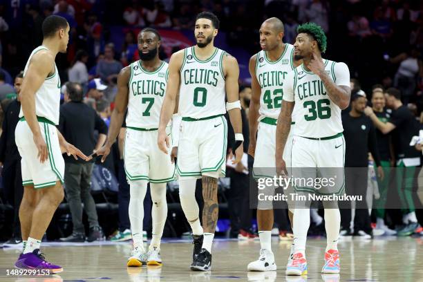 Malcolm Brogdon, Jaylen Brown, Jayson Tatum, Al Horford and Marcus Smart of the Boston Celtics talk against the Philadelphia 76ers during the fourth...