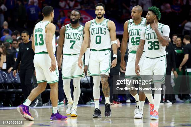 Malcolm Brogdon, Jaylen Brown, Jayson Tatum, Al Horford and Marcus Smart of the Boston Celtics talk against the Philadelphia 76ers during the fourth...