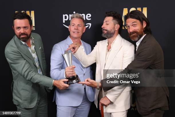 Brad Tursi, Trevor Rosen, Matthew Ramsey, and Geoff Sprung of Old Dominion, winners of the Group of the Year award, pose in the press room during the...
