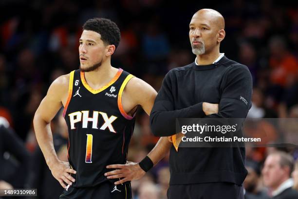 Devin Booker stands with head coach Monty Williams of the Phoenix Suns during the second quarter against the Denver Nuggets in game six of the...