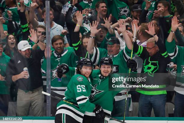 Roope Hintz of the Dallas Stars celebrates his goal with Thomas Harley during the first period against the Seattle Kraken in Game Five of the Second...