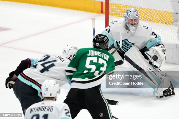 Philipp Grubauer of the Seattle Kraken tracks a shot from Wyatt Johnston of the Dallas Stars during the second period in Game Five of the Second...