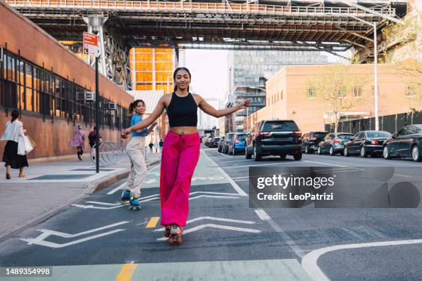 riding on roller skates in new york - roller skates stock pictures, royalty-free photos & images