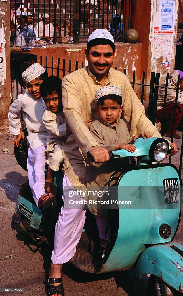 Father and sons leaving the Jamid Masji in Old Delhi after Friday prayers