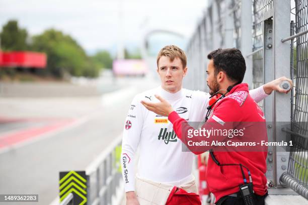Frederik Vesti of Denmark and PREMA Racing talks with a PREMA Racing team member in the Pitlane during day three of Formula 2 Testing at Circuit de...