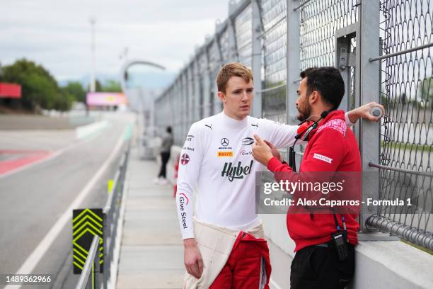 Frederik Vesti of Denmark and PREMA Racing talks with a PREMA Racing team member in the Pitlane during day three of Formula 2 Testing at Circuit de...